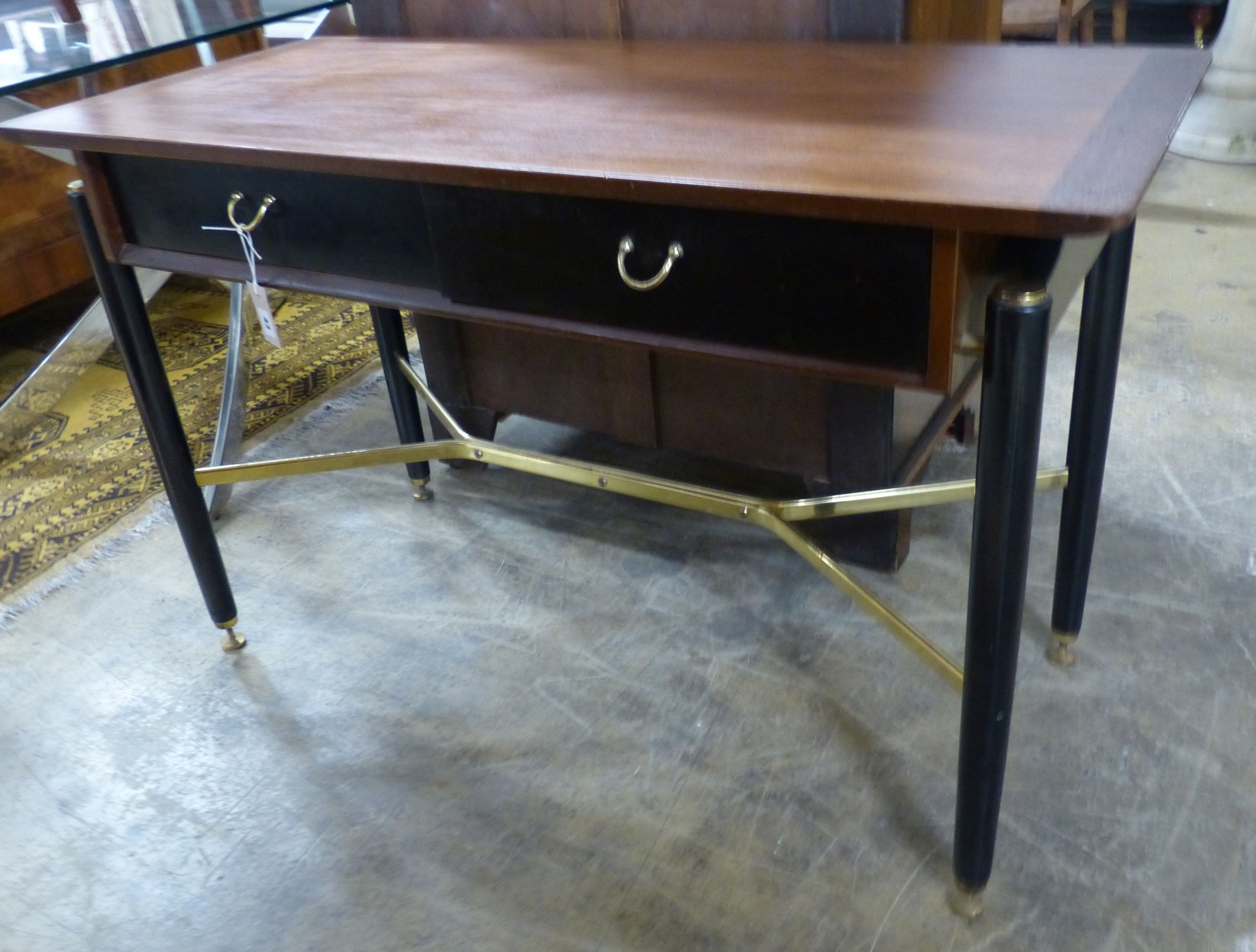 A G plan part ebonsed teak two drawer side table with brass X stretcher, W 120 D 52 H 75 cms.